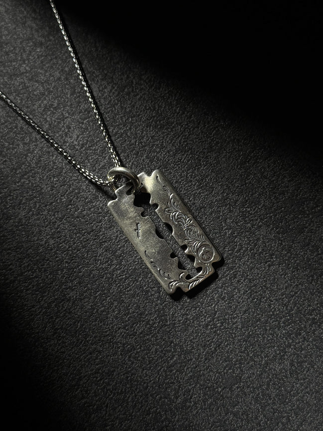 Handcrafted sterling silver razor blade pendant necklace with vintage engraved details