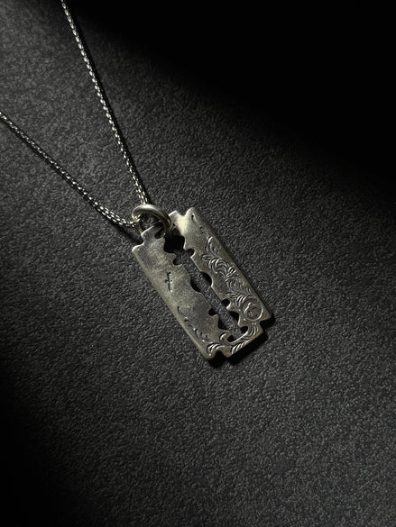 Handcrafted sterling silver razor blade pendant necklace with vintage engraved details