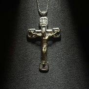 Sterling silver crucifix pendant necklace featuring a detailed Jesus cross design