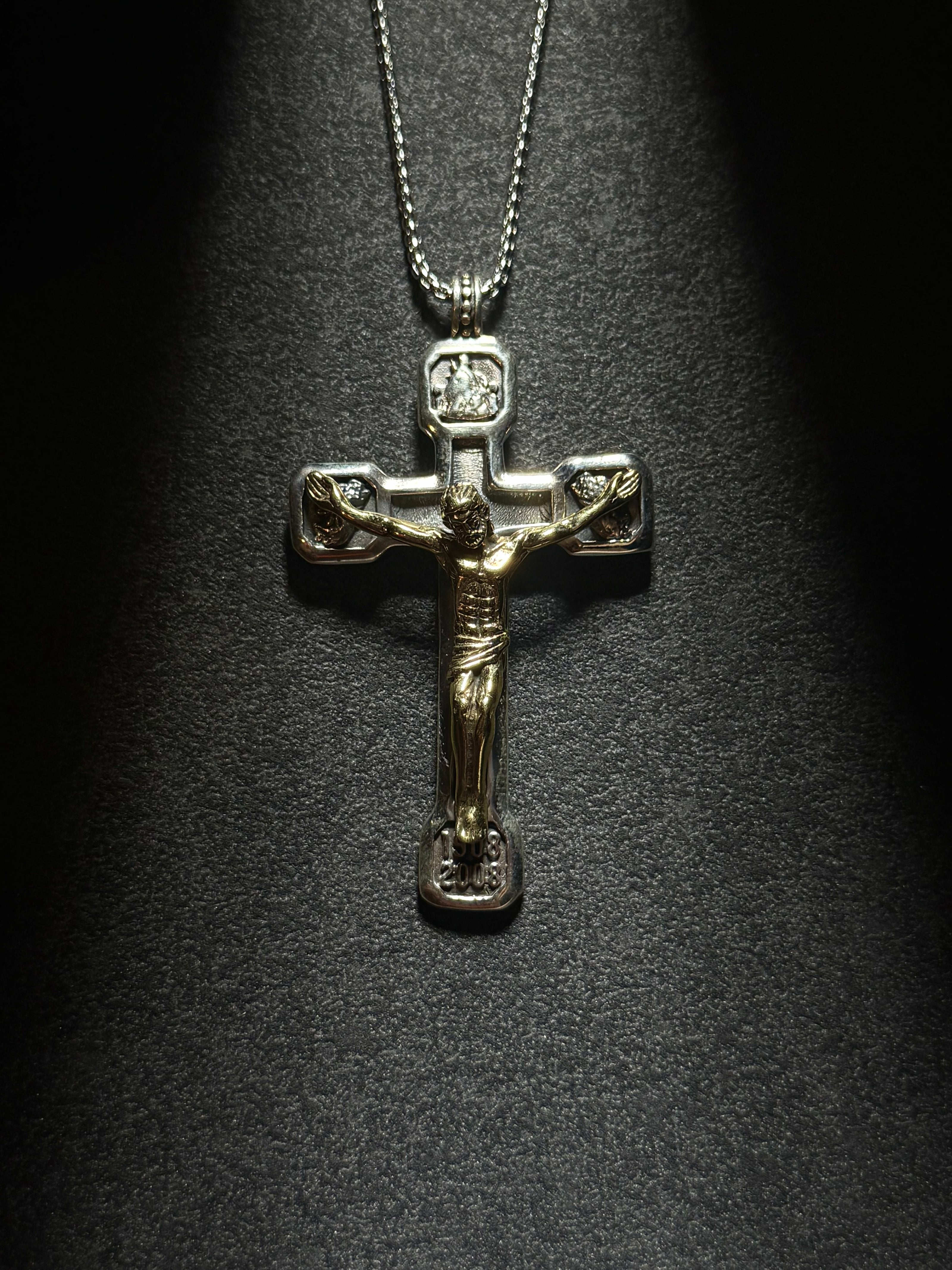 Sterling silver crucifix pendant necklace featuring a detailed Jesus cross design