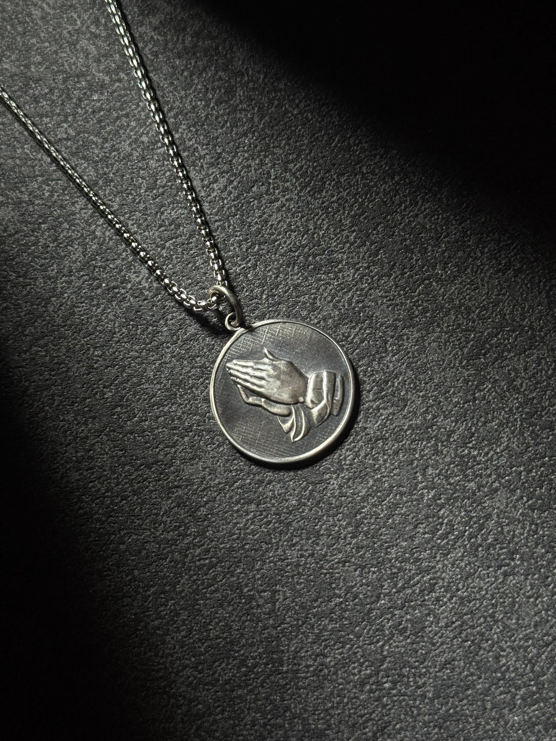 Sterling silver praying hands medallion pendant necklace with oxidized finish