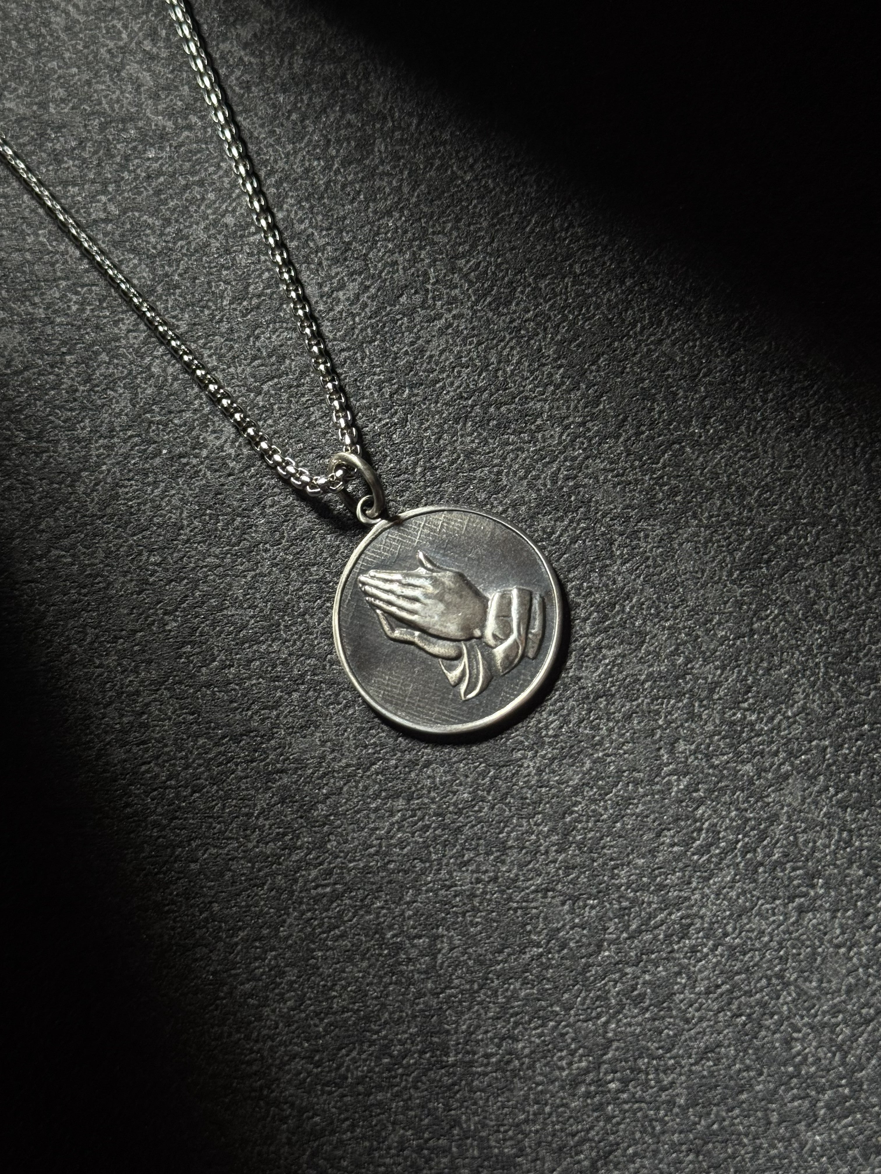 Sterling silver praying hands medallion pendant necklace with oxidized finish
