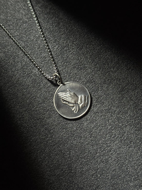 Sterling silver praying hands medallion pendant necklace with oxidized finish