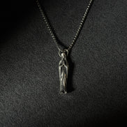 Handcrafted oxidized sterling silver Virgin Mary pendant necklace on a silver chain.