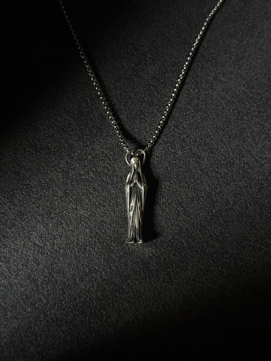 Handcrafted oxidized sterling silver Virgin Mary pendant necklace on a silver chain.